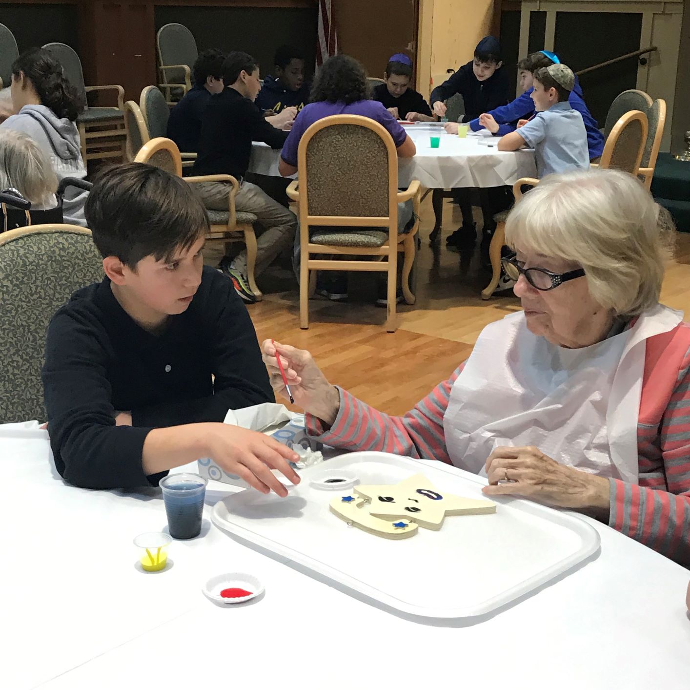 Senior and child playing dominos