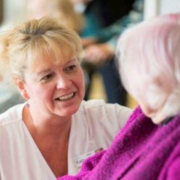 Caregiver speaking with senior