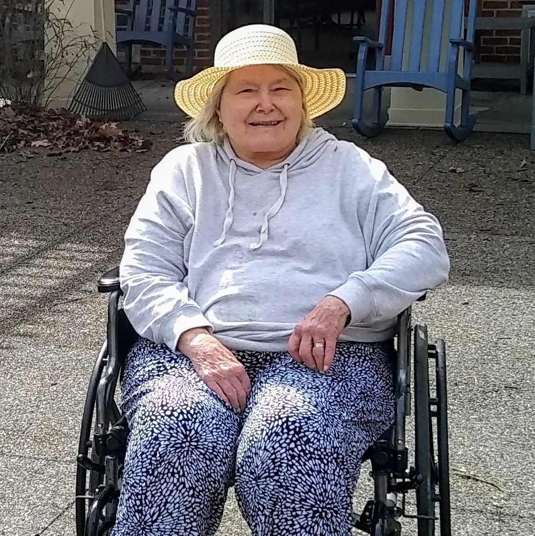 Senior outside of AHAVA in a wheelchair