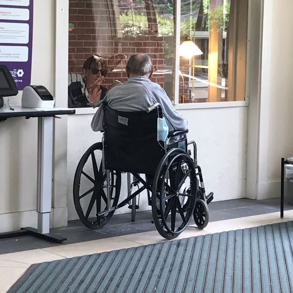 Window Visit with a senior in a wheelchair