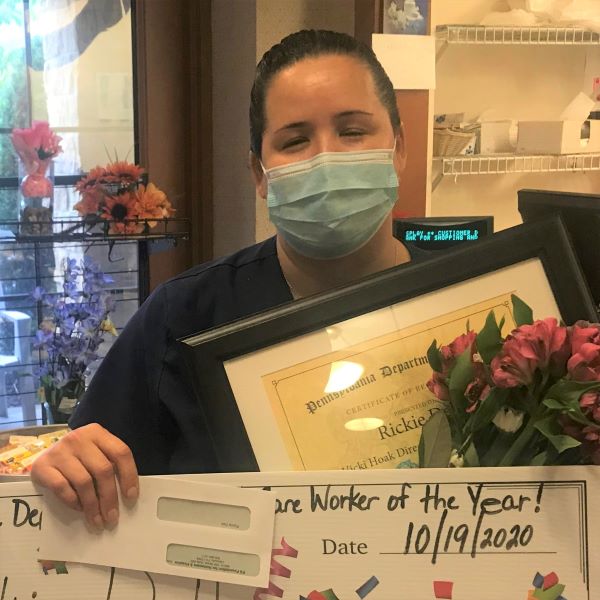 Woman in mask with awards