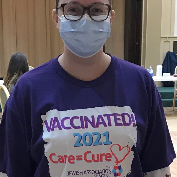 Colleen wearing a vaccinated 2021 t-shirt